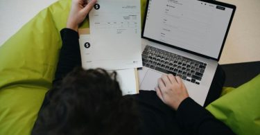A Person Holding A Paper