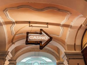 Casino Sign in the Form of an Arrow Hanging from a Ceiling